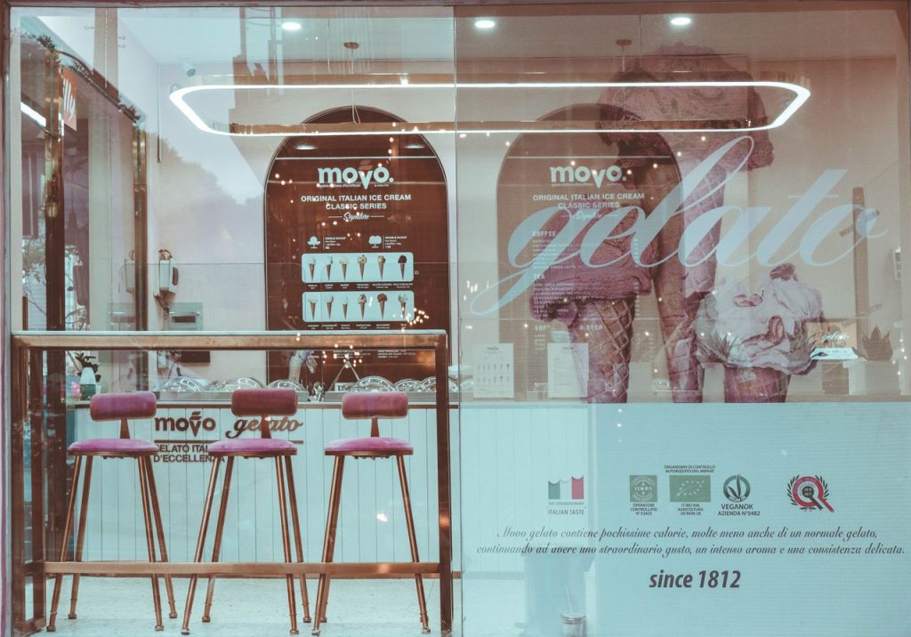 Sleek urban gelato shop featuring stylish seating and contemporary design, perfect for enjoying Italian ice cream.