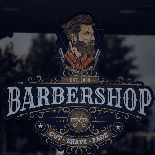 Detailed vintage barbershop logo featuring a bearded man on a reflective glass window.